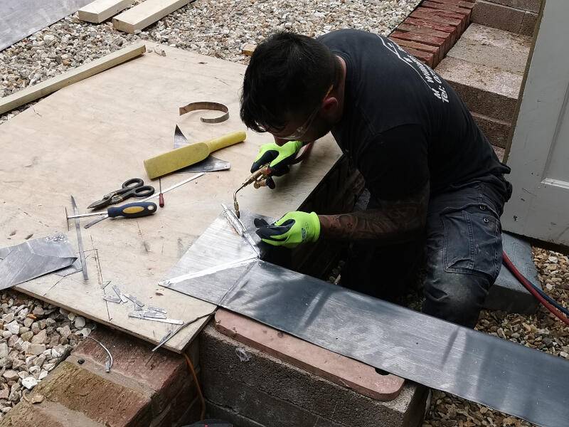Ludwell Valley Roofer performing roof repair work